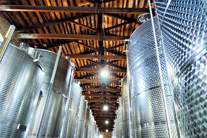 inside look at a winery's barrel facility